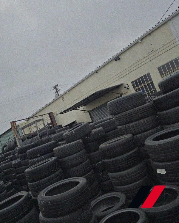 Marked tire stacks in outdoor yard